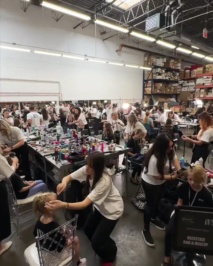 The YFS hair and make-up hall full of stylists and participants before a show
