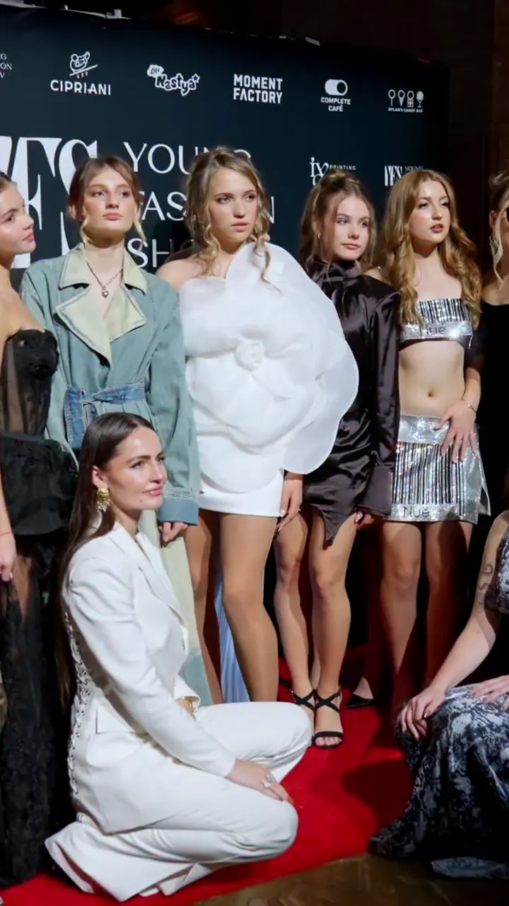 A YFS show from arrival to runway: the venue, hosts on stage, families on the red carpet, models walking and the designer line-up
