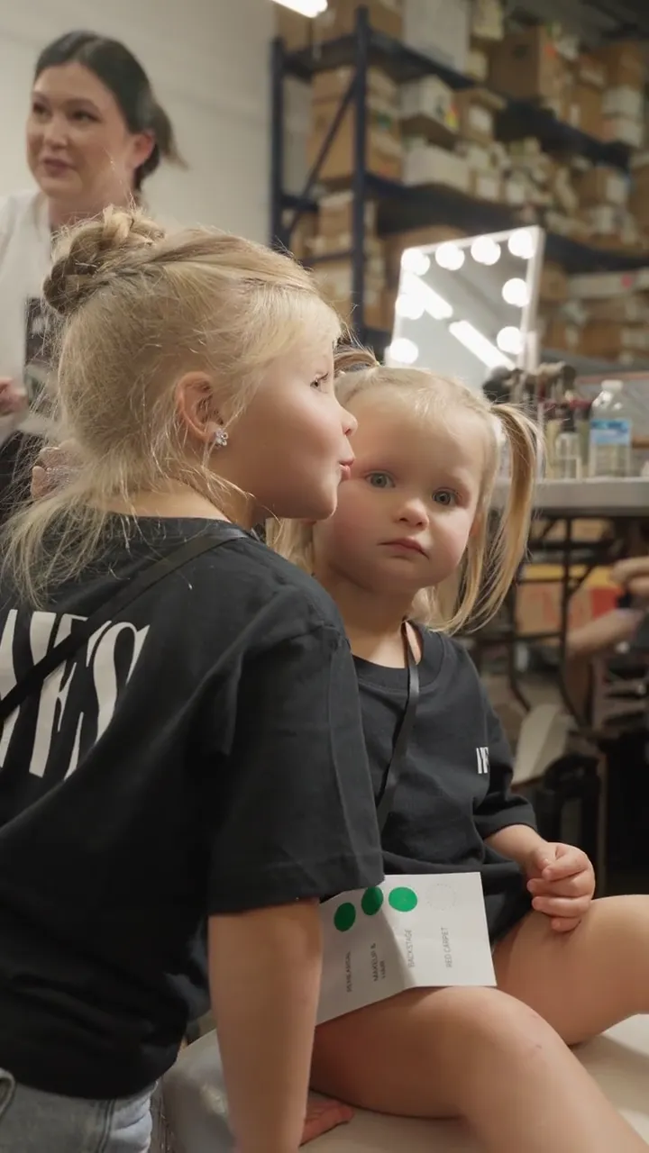 Two of the youngest participants backstage with the YFS beauty team
